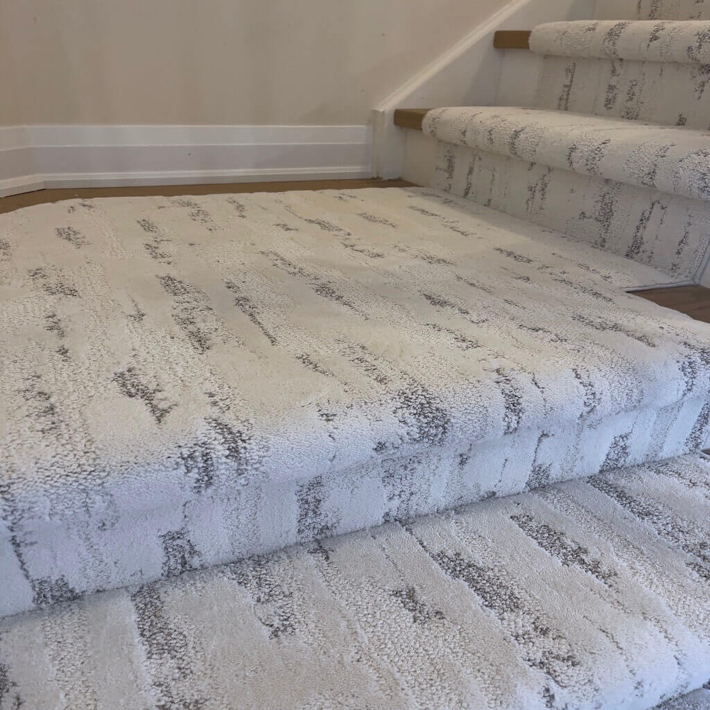 Neutral patterned carpet available for custom rugs and stair runners