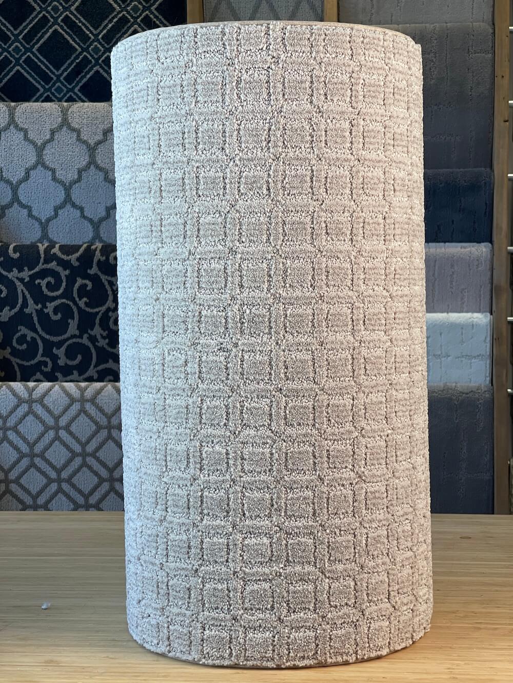 Finished patterned carpet roll representing custom area rug fabrication