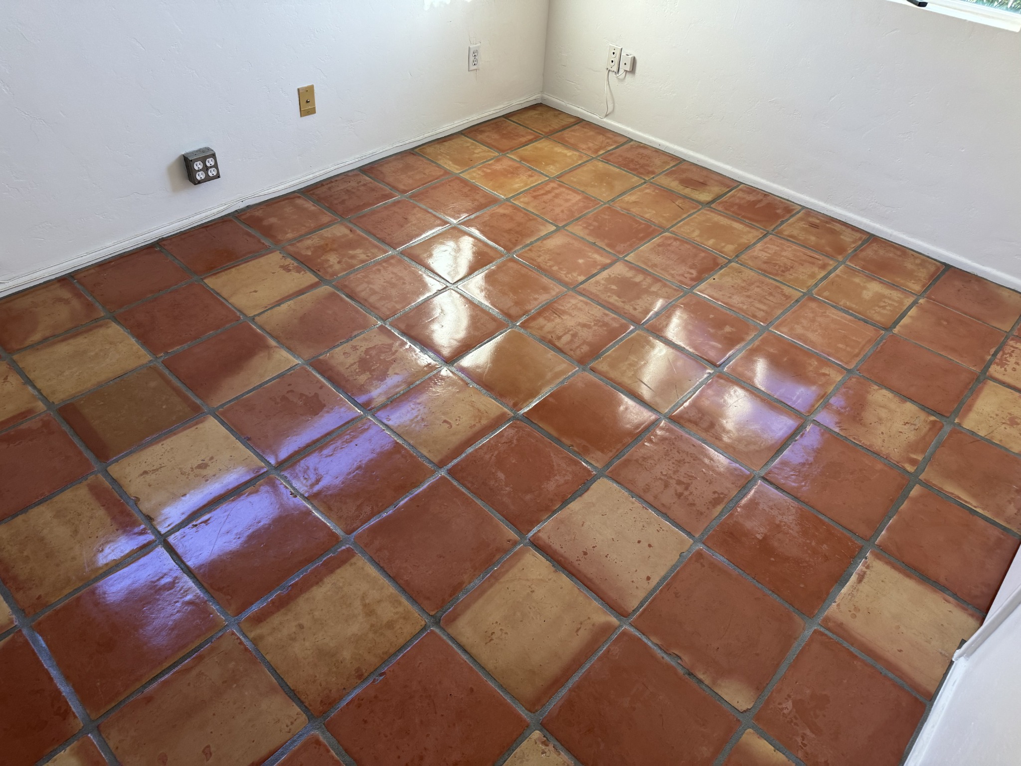 Finished Saltillo tile floor showing coordinated grout and sealed surface